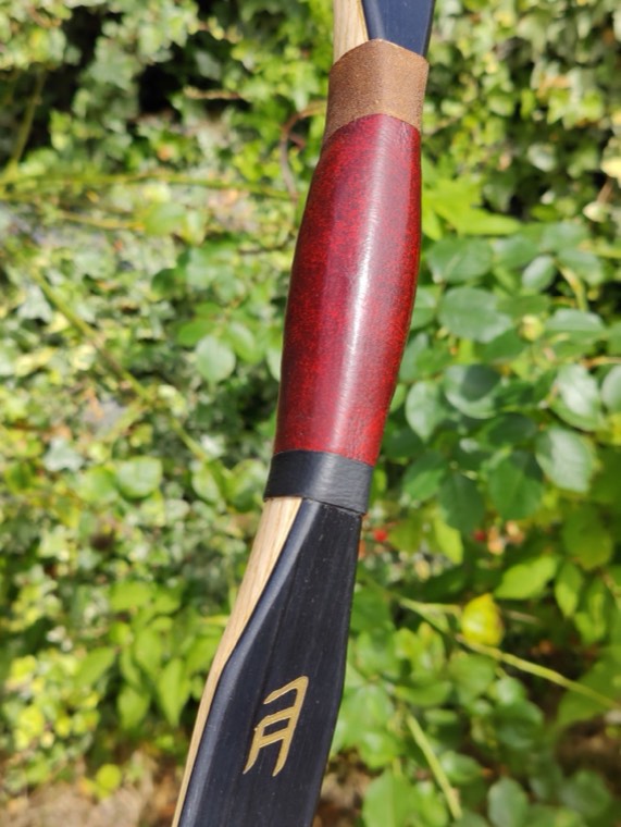 Griffin, red leather grip and arrow pass